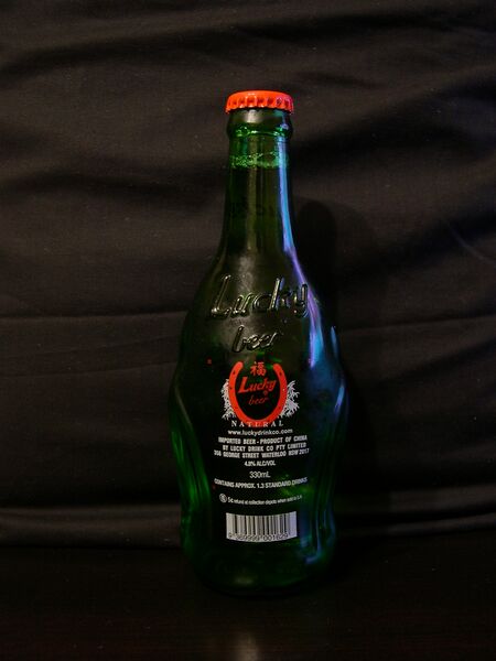 File:Lucky Buddha beer bottle rear.jpg